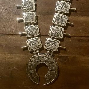 16 inch long sterling silver squash blossom necklace with 10 etched pictographs